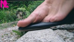 Shoeplay with Black Leather Flats on Barefoot Outside