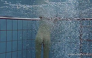 Roxalana Cheh floating naked alone in the pool