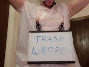 Whore in trash bag drools with humiliation