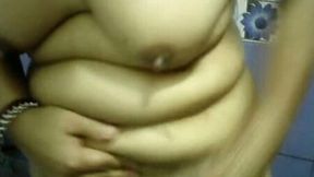 Dirty-minded chubby brunette washes her plump belly and titties