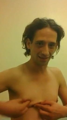Topless Transgirl Trying to Hold a Pen W/her Tiny Boobs