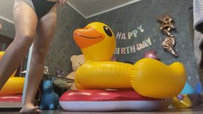 Valeri riding on 2 inflatables toy