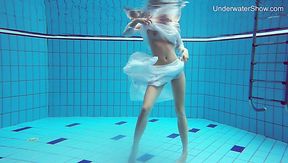 Lovely looking beauty in floating white dress Diana Zelenkina swims sexy