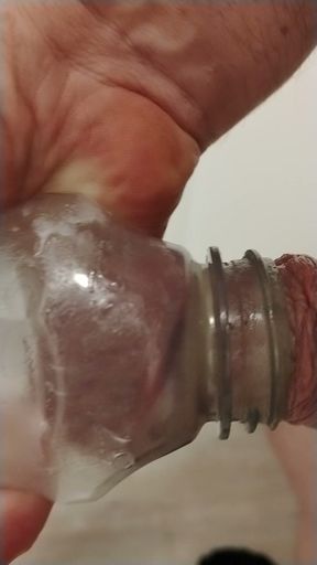 Pumping balls and sucking cock in bottle