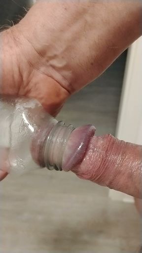 Pumping balls and sucking cock in bottle