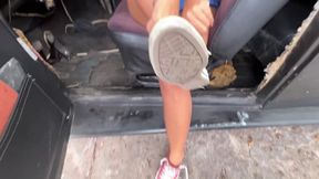 Dalilah picks up the car after running and is sweaty