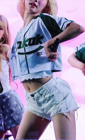 K-pop fan with a belly plays with her belly button