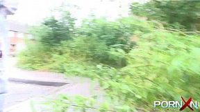 Brunette with big tits wets herself in public while playing with her pussy