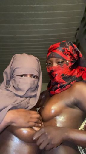 Ebony ladies massaging each other&#039;s boobs