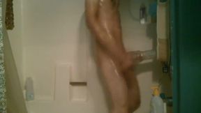 Slim babe jerks off with Flesh Light and shower attachment