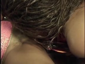 Two horny ebony lesbians fuck with a dildo on a stage