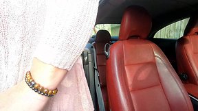 Kelly playing with new toy in pink dress and pantyhose in car