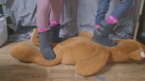 Dania and Chrissy trample big stuffy in matching boots