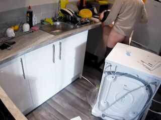 Excited wife seduces plumber in the kitchen whilst spouse at work
