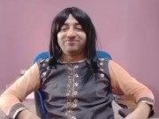 Young sissy crossdresser femboy in a cute little dress on the chair.
