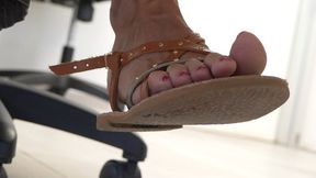 Feet and sandals fetish under desk, lovely feet and toes close-up
