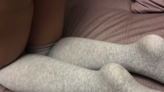 Sexy girl show feet in pantyhose and gray knee socks stockings