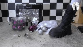 Christmas tree decorations under Christins strong Boots