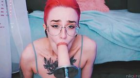 Tattooed nerd with glasses sucks fucking machine's sildo