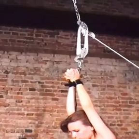 Kinky dom puts his sub female in a suspension bondage