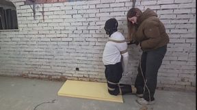 Male slave is stored in her basement and used as a furniture