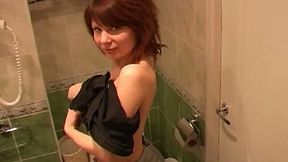 Redhead marvelous cutie in the toilet room undresses and pisses on cam