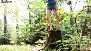 German lass wets her panties in the forest with jeans on