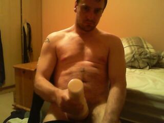Sitting on chair watching porn banging a felsh light untill I ejaculate