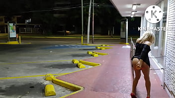 Sissy masturbating her ass in a supermarket public parking lot for cars and passers by to enjoy