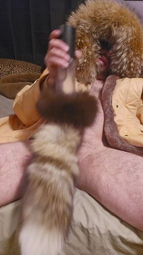 In big fur parka masterbating with furry cock sucker penis pump toy with fox tail