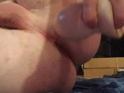 Stuffing a large toy in my ass followed by my fist.