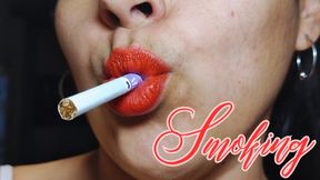 Smoking red lips close up