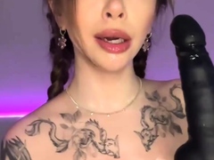 The long-haired nymph in a cat costume provides a suck