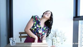 Dark-haired beauty plays with a massive dildo