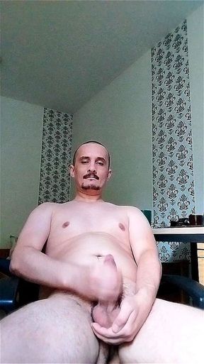 Fat guy with big balls masturbates to porn and cums