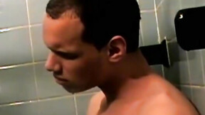 ”Handsome deviant masturbating passionately in bath”