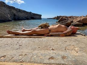 Mistress NaomiPerv uses slave paul in a public BDSM play on an Ibiza beach