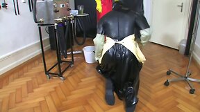 Bizarre rubber enema servant 2 of 5