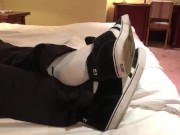 Male dress shoes, nikes, globes and white socks shoeplay in a nice hotel