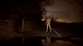 Crazy naked exhibition barefoot with cars passing close