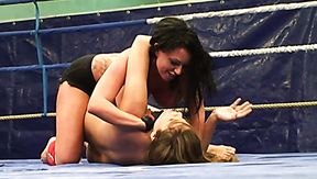 Two tasteful whores rub their aroused bodies over each other inside boxing ring