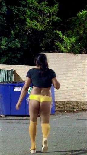 More sexy walking outdoors in yellow shorts