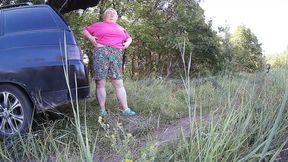 Stepmom strokes her wet slit in the open air