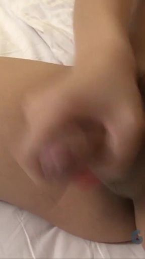 Small tit Asian shemale strips and tugs her hard cock