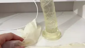 Nurse slams huge dildo in her fist with oily hands