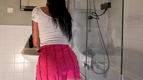 Hot sexy slim tight pussy beauty in the bathroom prepares for night out in a pink cut mini skirt