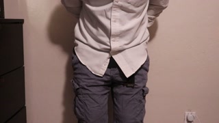 Desperate and handcuffed guy wets his pants