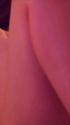 Short-haired blonde Emily masturbates on the bed