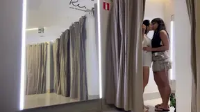 Hot brunettes making out in the mall fitting room