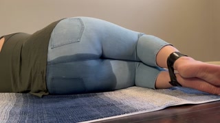 Tied up girl can’t hold it anymore pees in light jeans